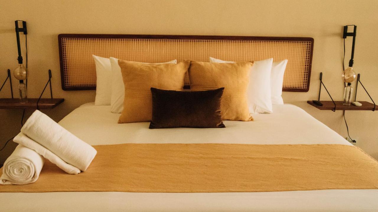 Xperience Tulum Hotel Exterior photo A bed with a mattress
